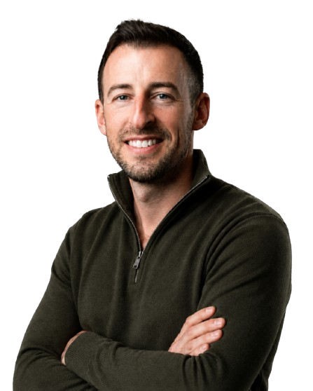 Chad Wolpert, smiling with arms crossed
